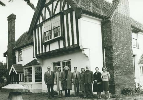 Photo of F. Clive Ross and group outside Pates Manor